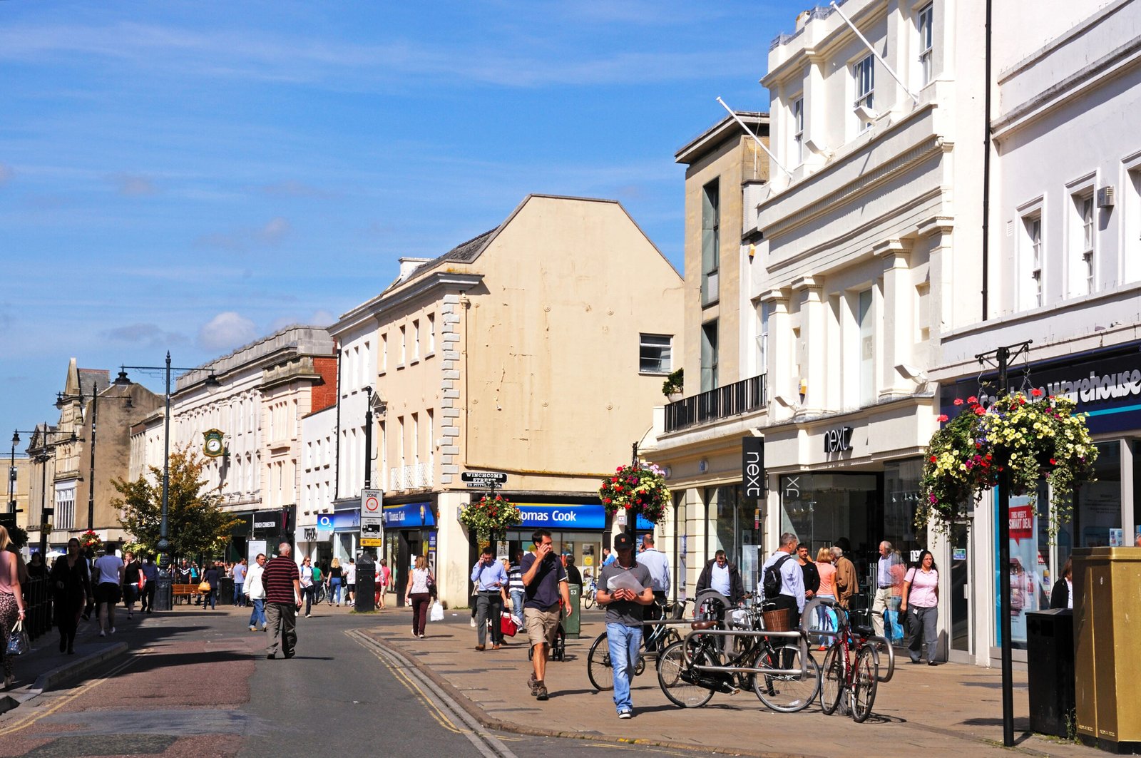 Cheltenham-High-street Shops with shoppers and tourists along the High Street, Cheltenham, Gloucestershire, England, UK, Western Europe.
